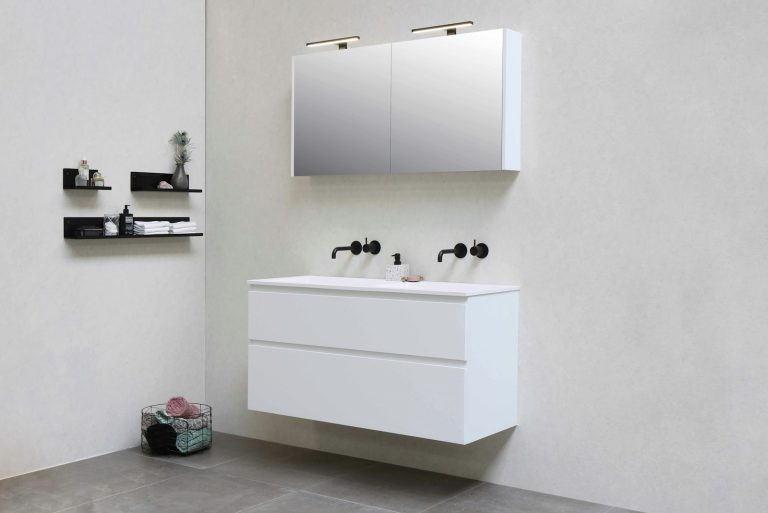 white wooden kitchen cabinet with black and white ceramic mugs on top