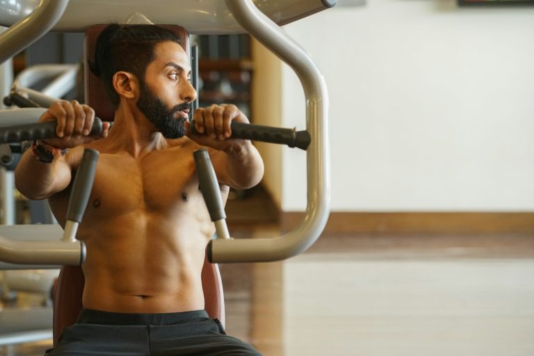 man sitting on exercise machine